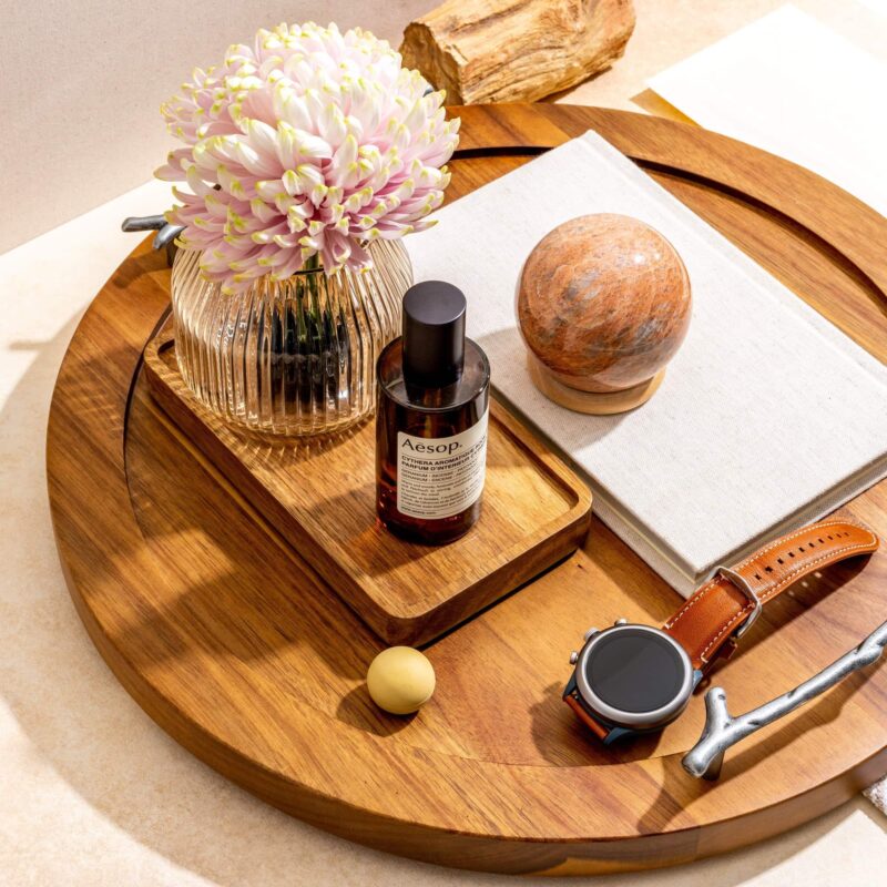 A round tray with handles used as an organizer
