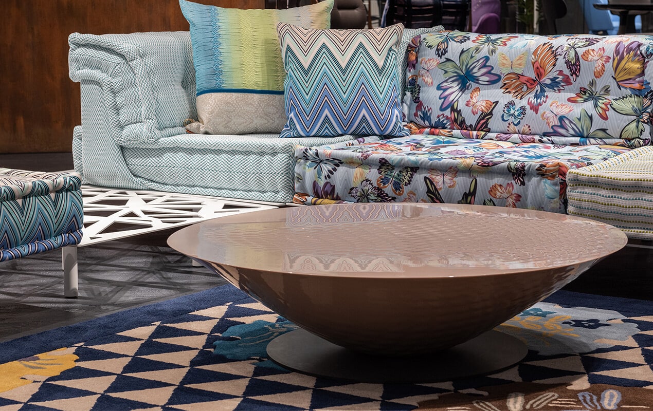 Sofa and floor rug with patterns and a round table