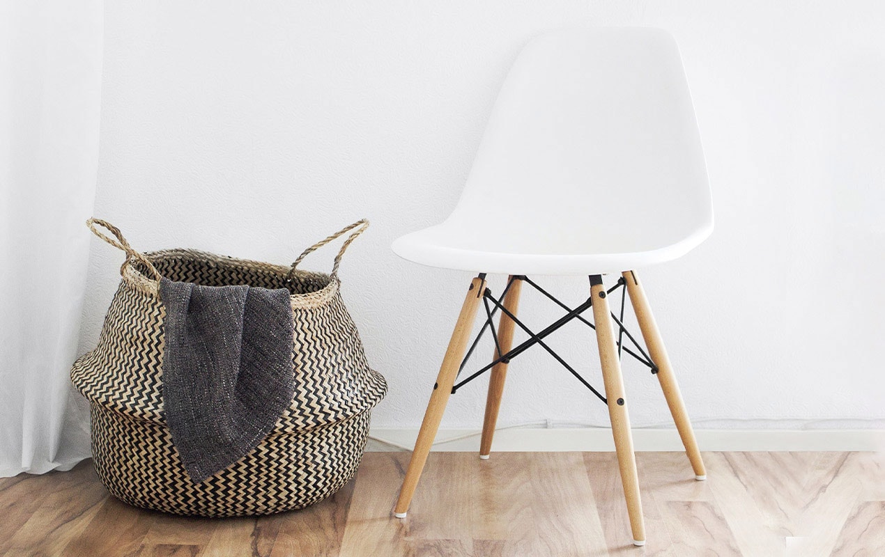 A rattan basket and chair for a small apartment