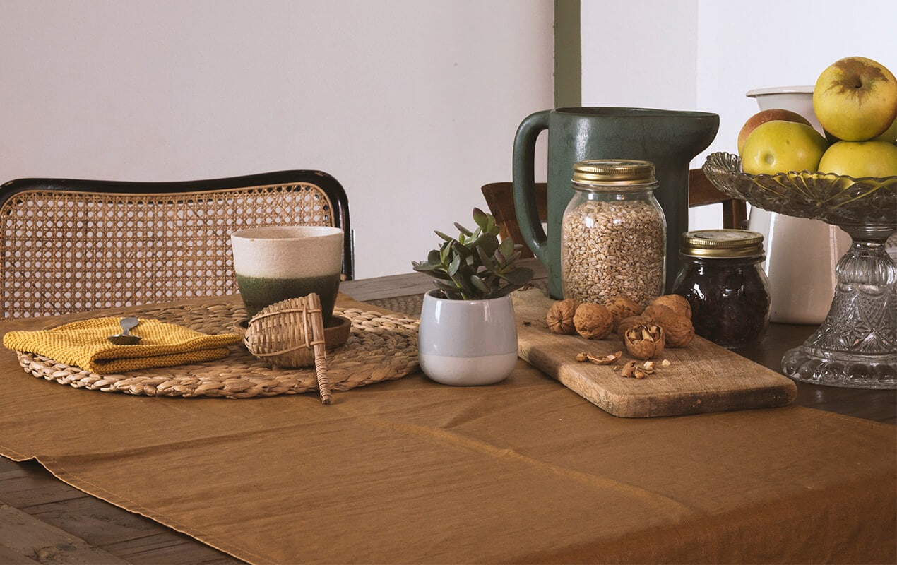 Fruit, seeds, and nuts on a table with decor