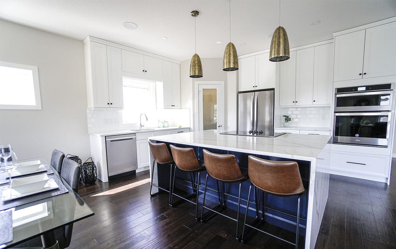 White Breakfast bar in kitchen with tall chairs