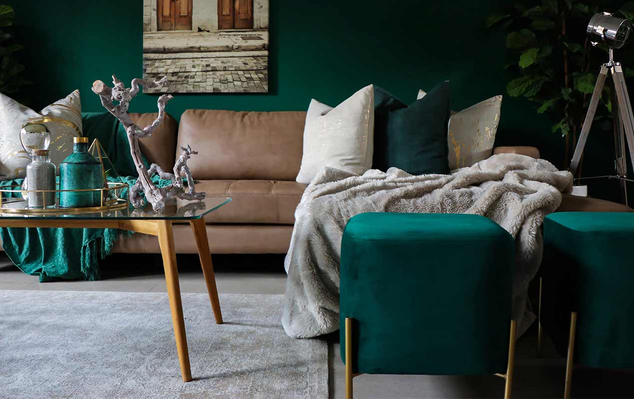 Green living room decor using throws and cushions