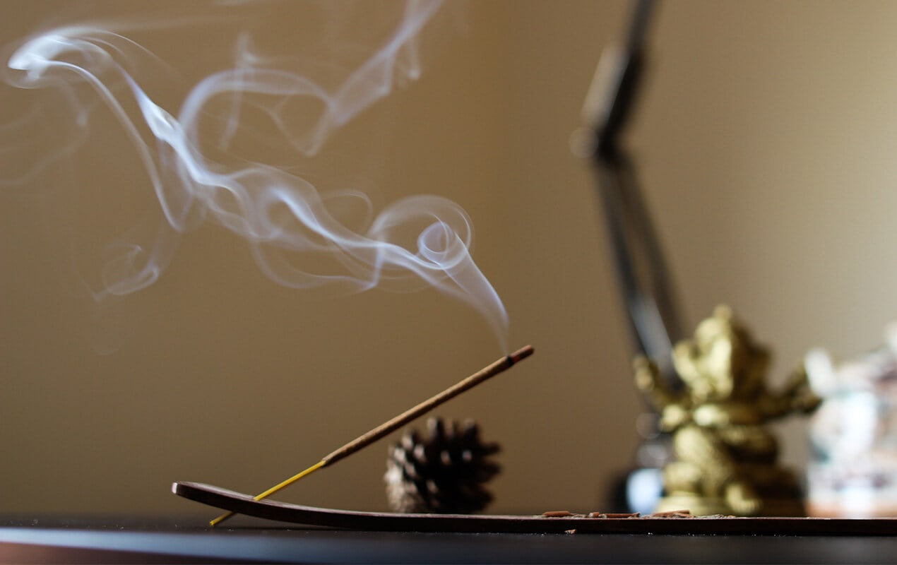 Incense sticks with background ornaments