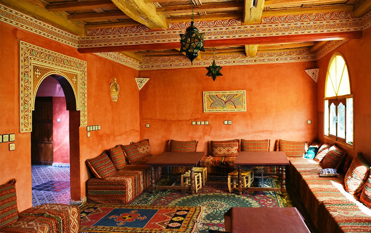 Orange room with Moroccan style seating