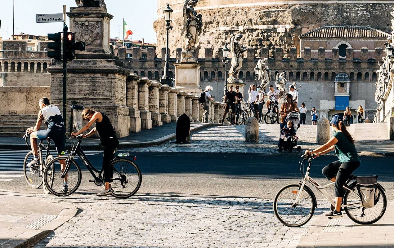 Cyclists biking through a city