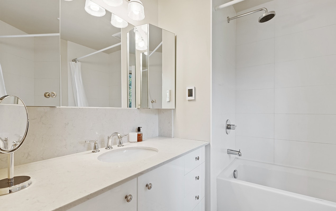 White bathroom design with mirrors