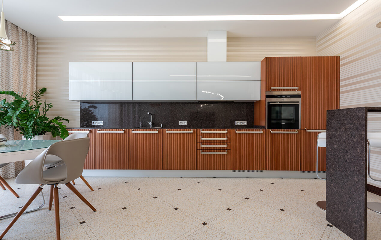 Cream tiled floor, brown kitchen interior