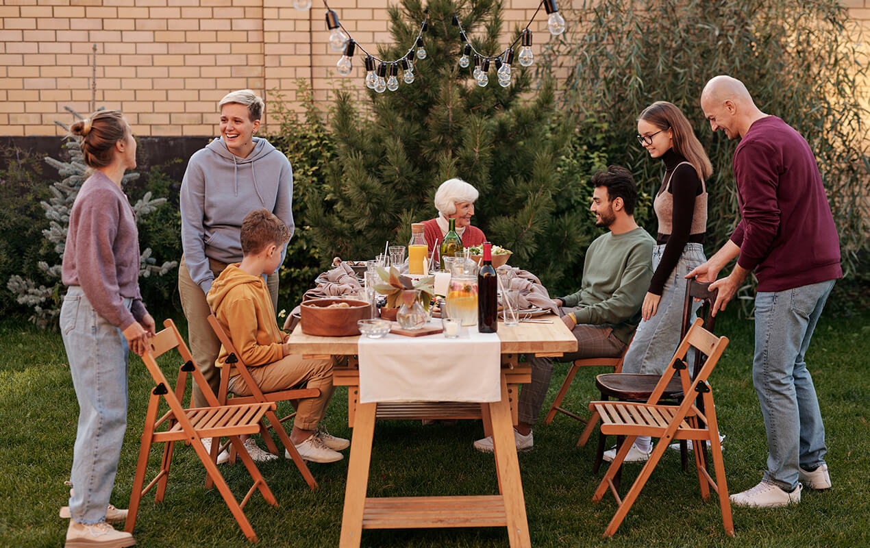 Outdoor dining table with food and family