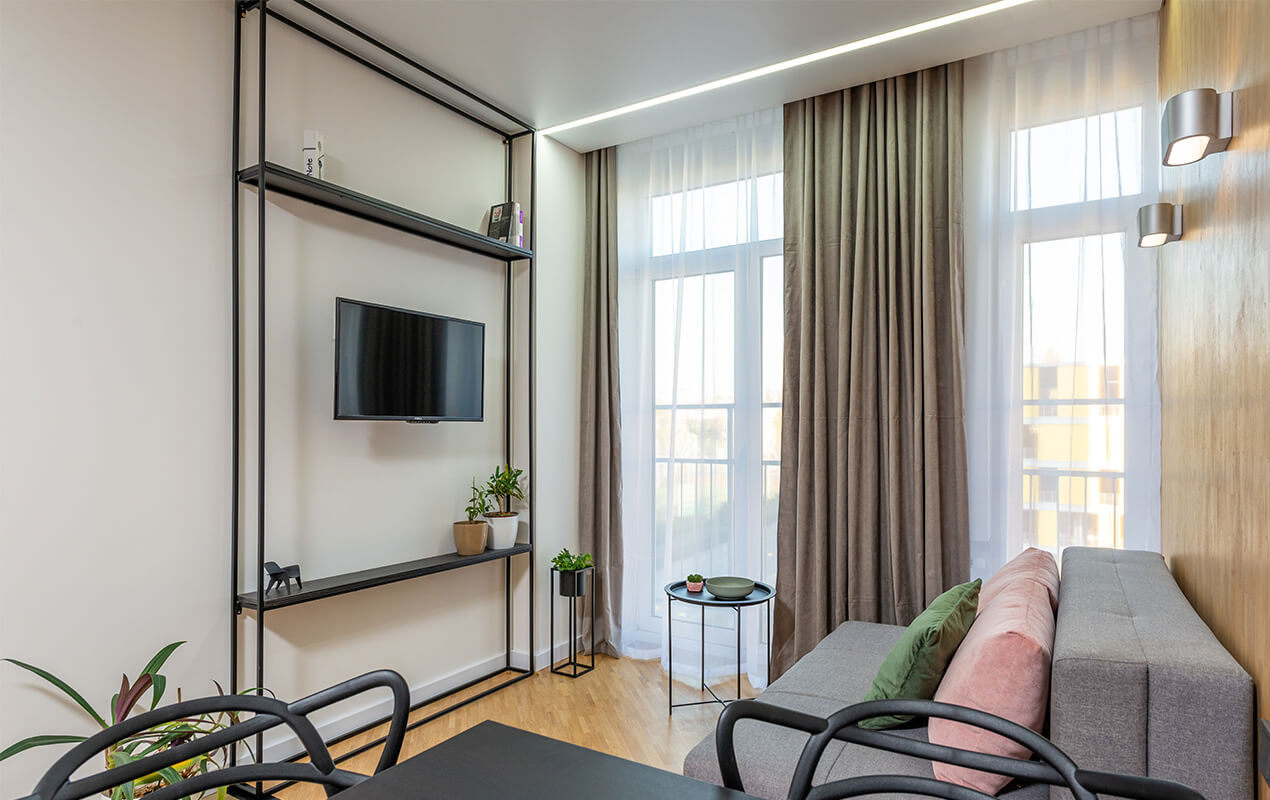 Modern Living with curtains, sofa, and console stand
