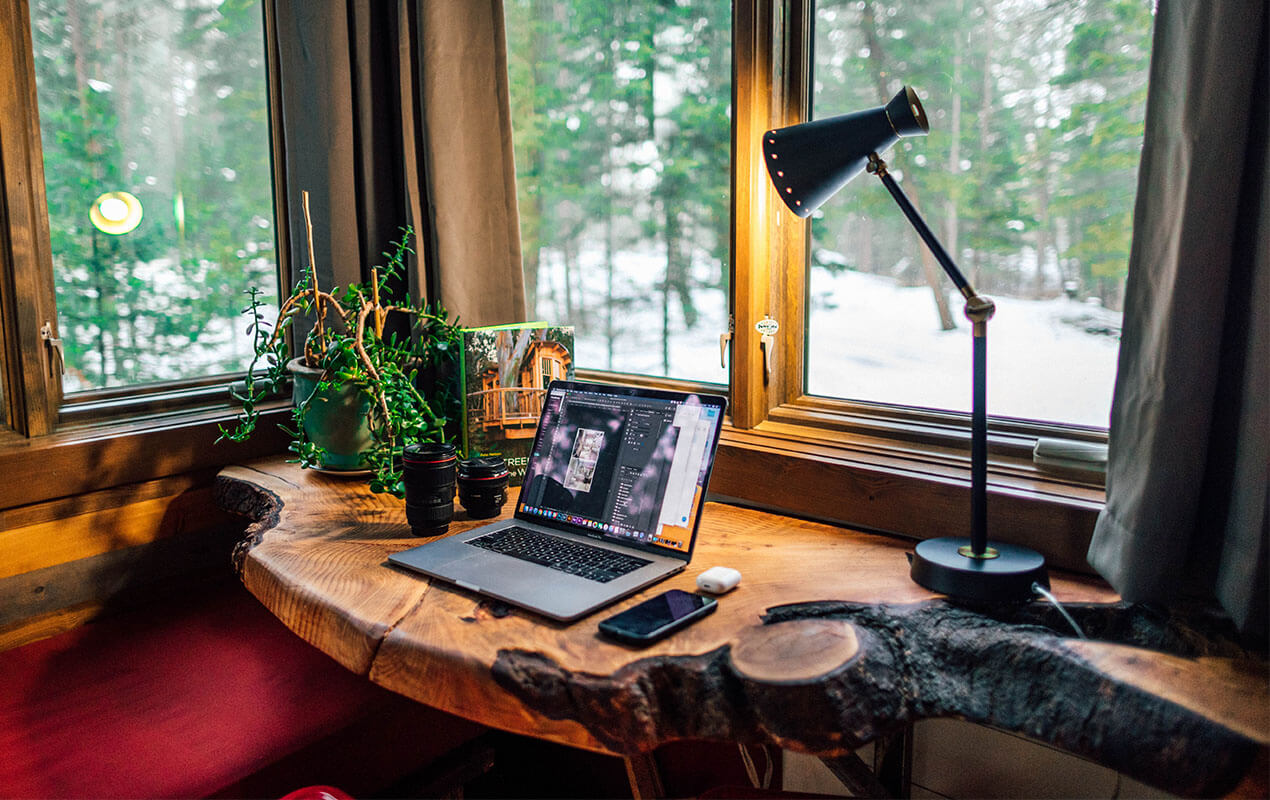 Rustic interior with laptop and lamp