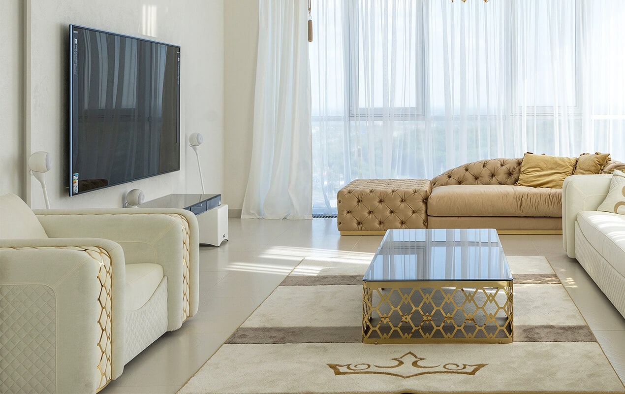 White living room with gold furniture