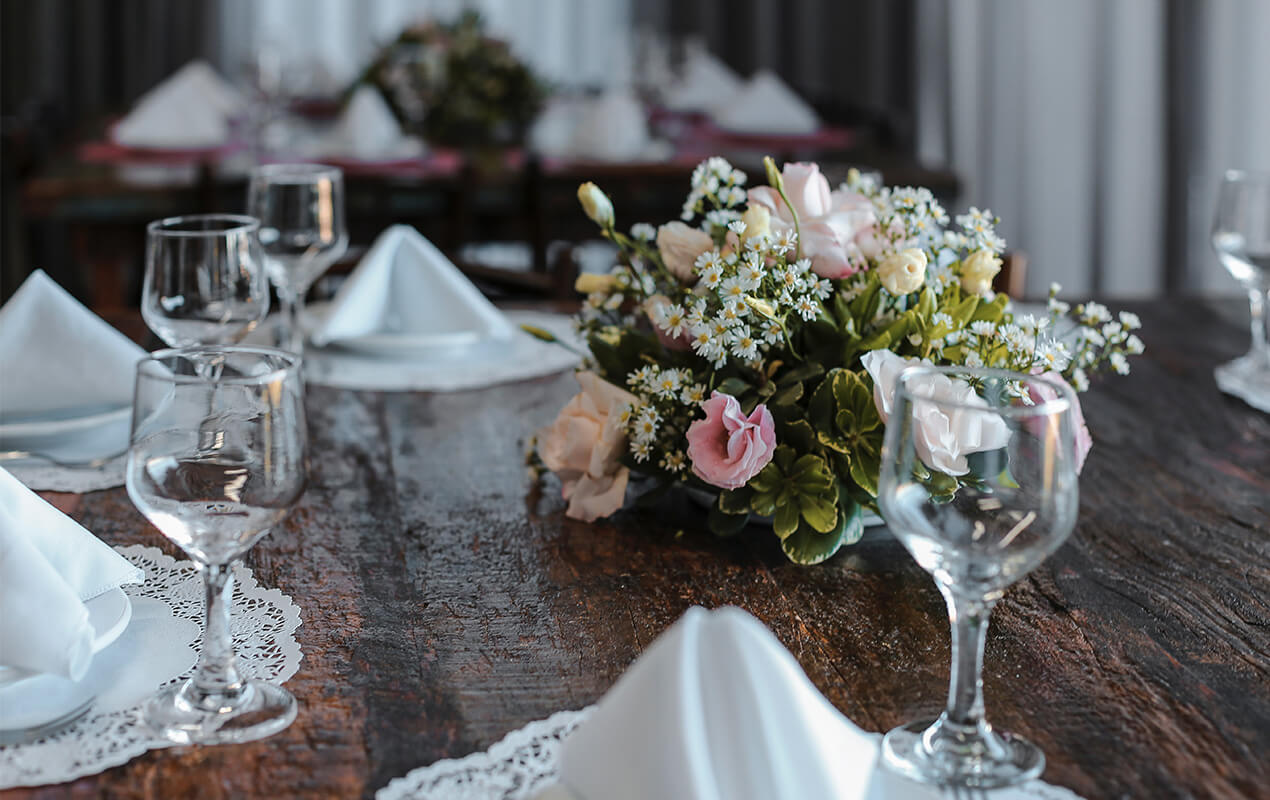 Rustic with glasses and a floral centerpiece