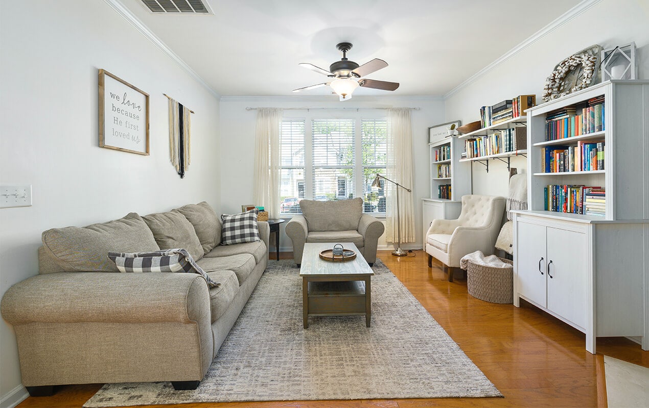 Rectangular living room design wih furniture and bookshelf