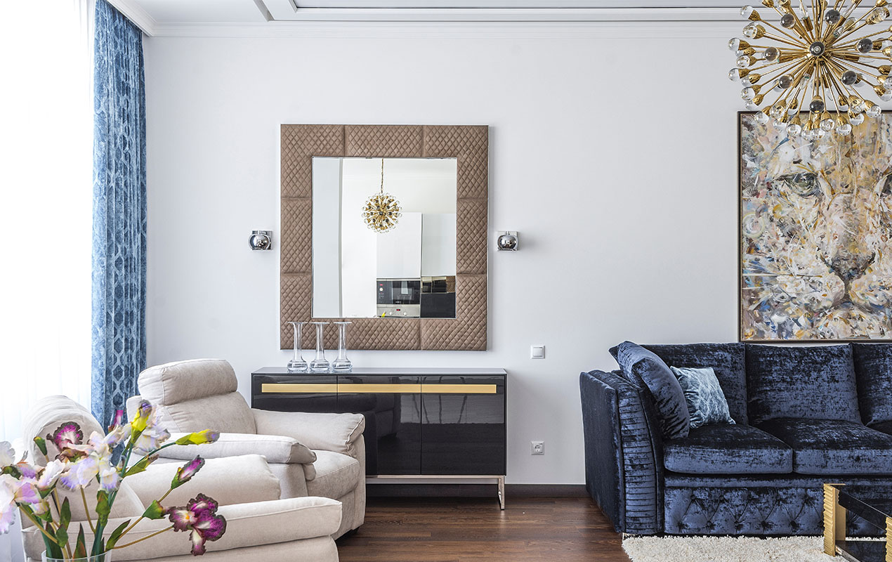 Narrow living room with wall art and a mirror