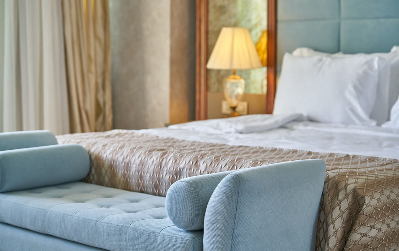 Bedroom inteiror with blue futon.