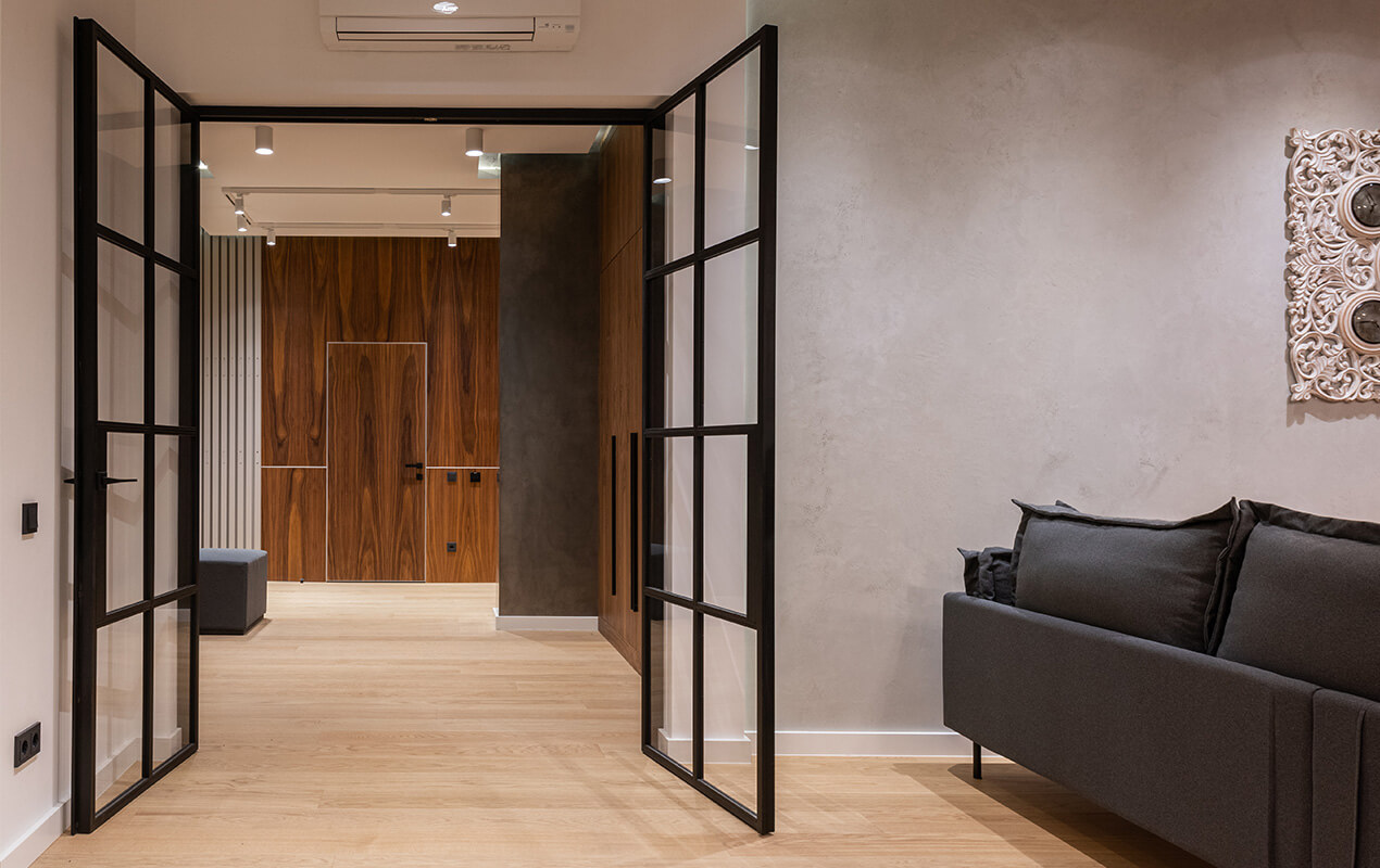 Interior black glass doors open to living space