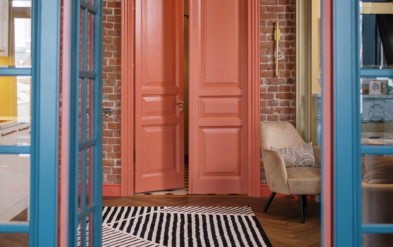 Pink doorway with floor rug