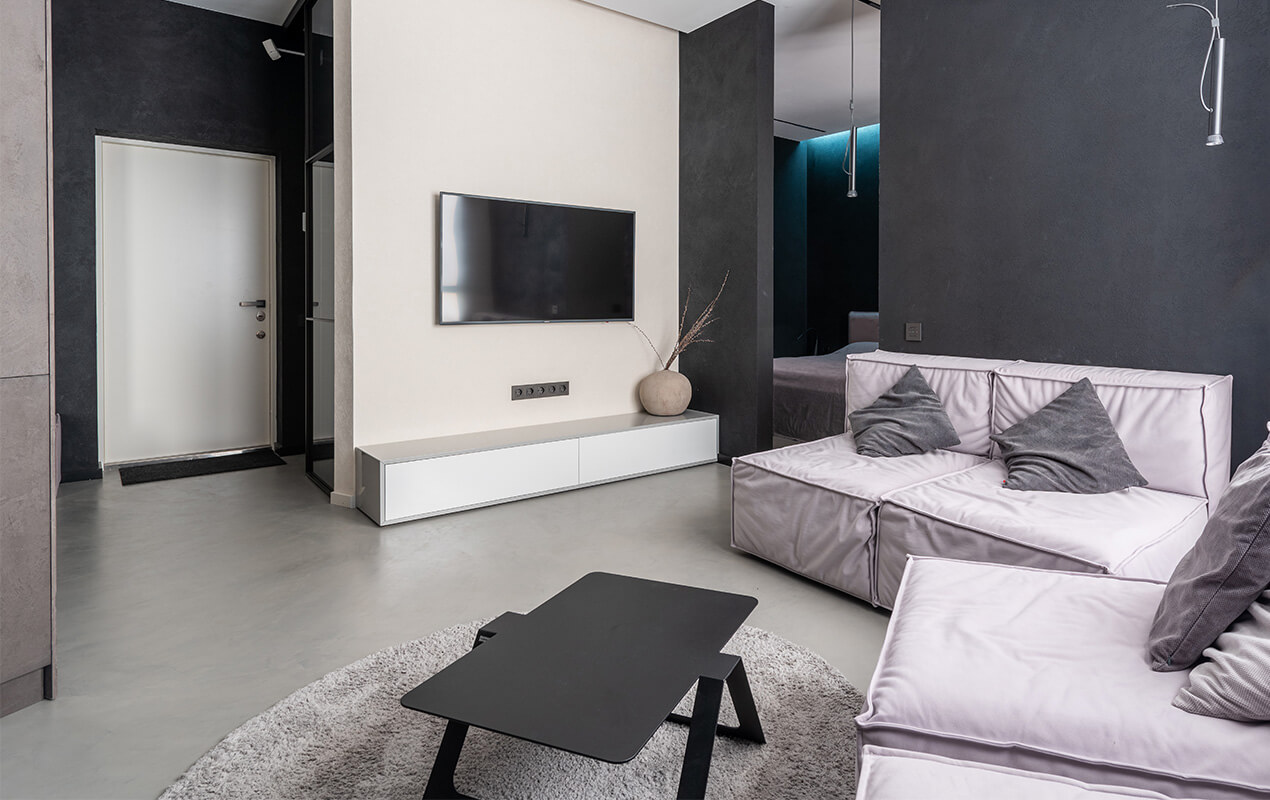 Black and grey interior with a white accent wall