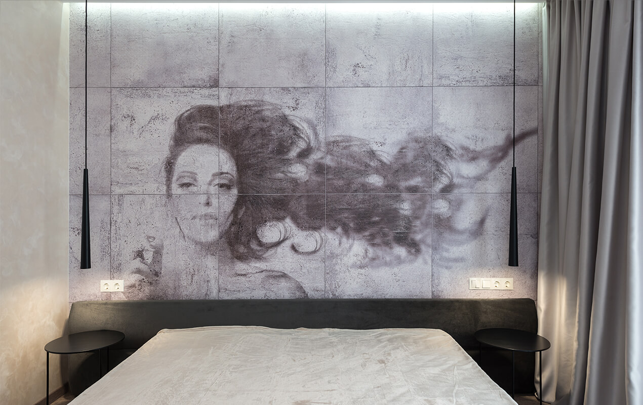 Bedroom décor with a black and white wall mural of a woman's face