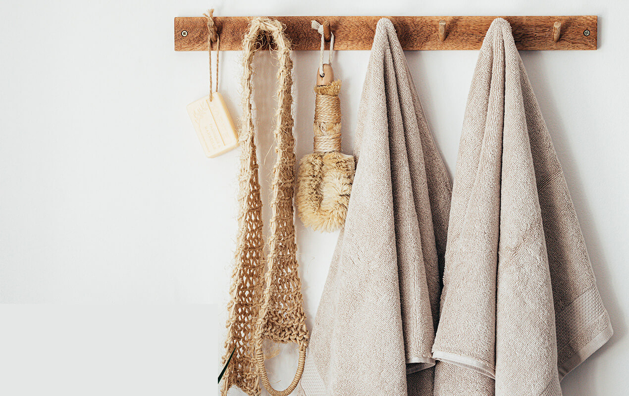 Hung towels on a wooden wall rack