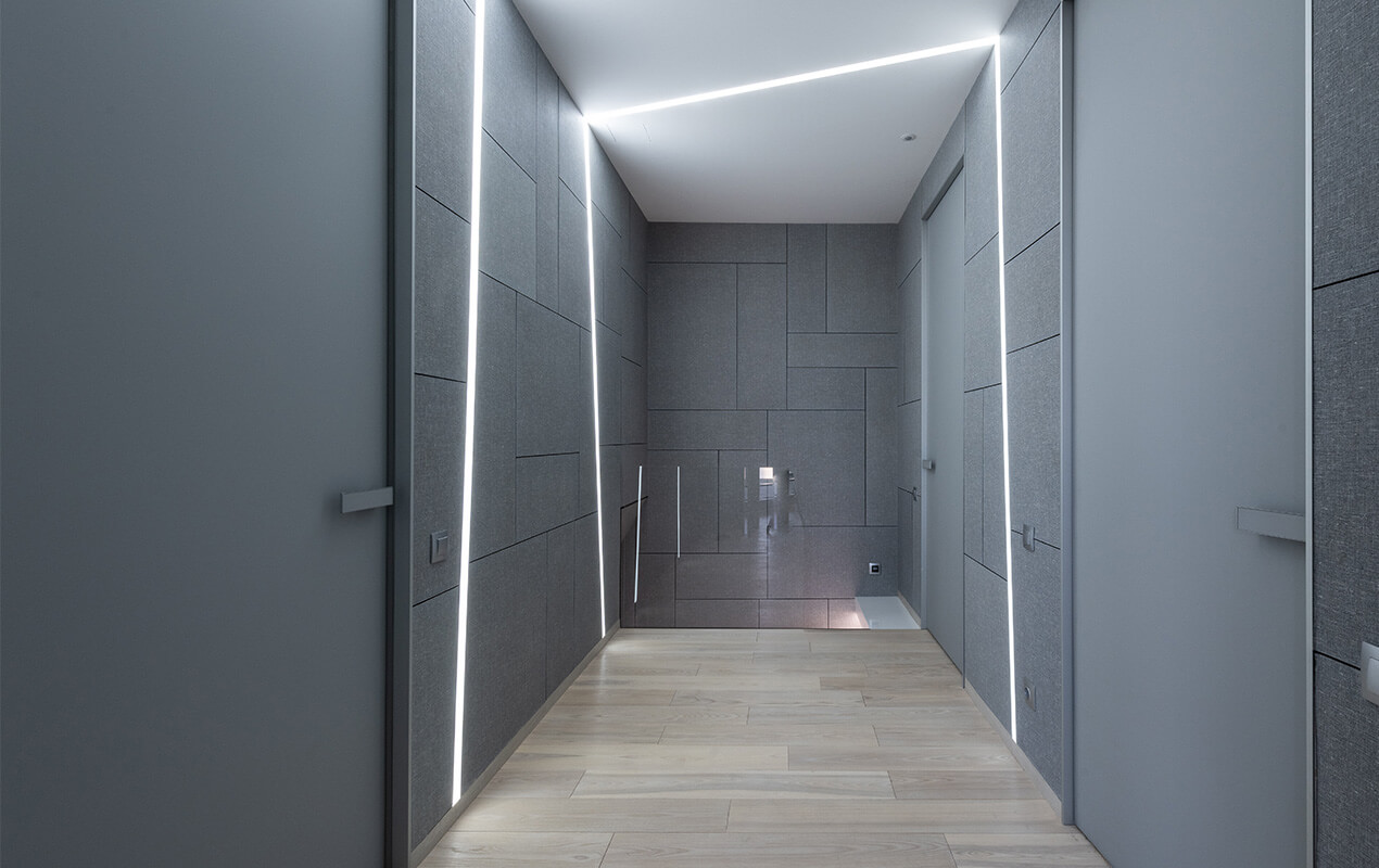 Grey corridor with strip lighting