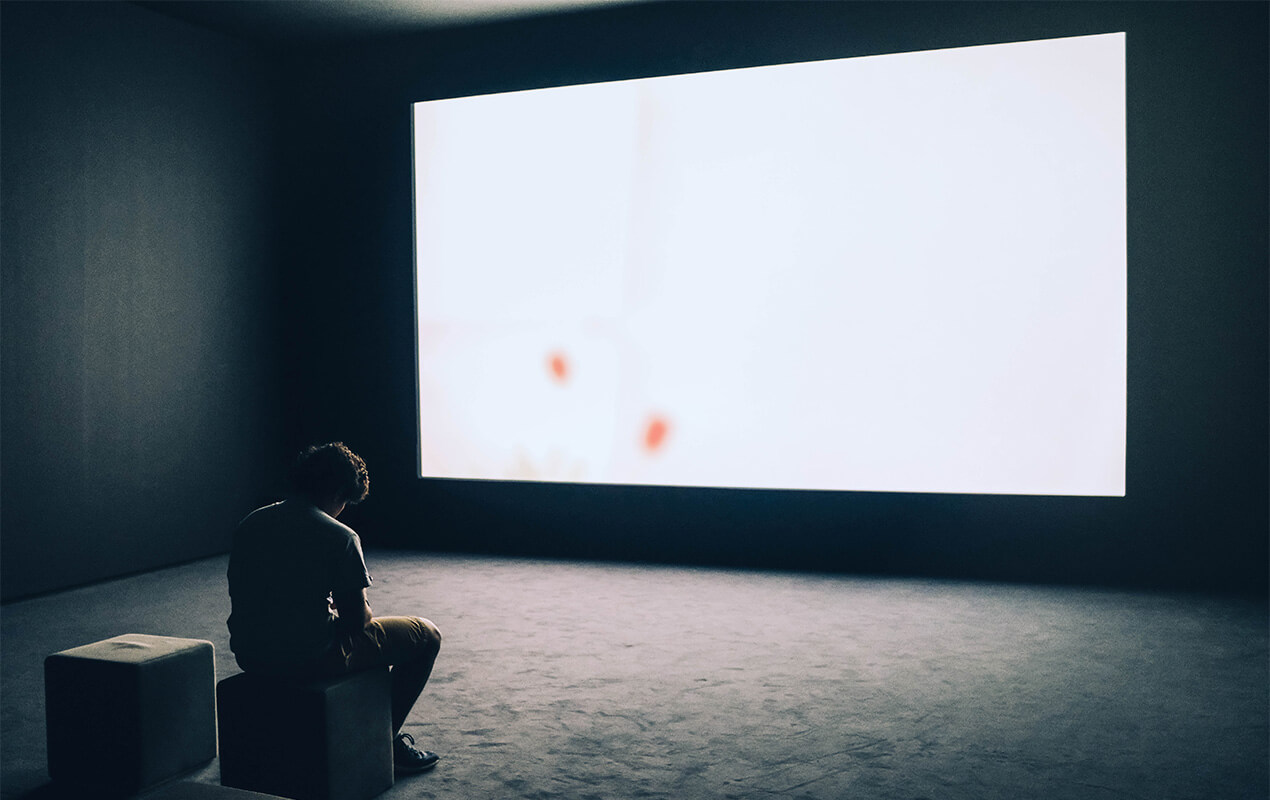 A home cinema room with a dark setting