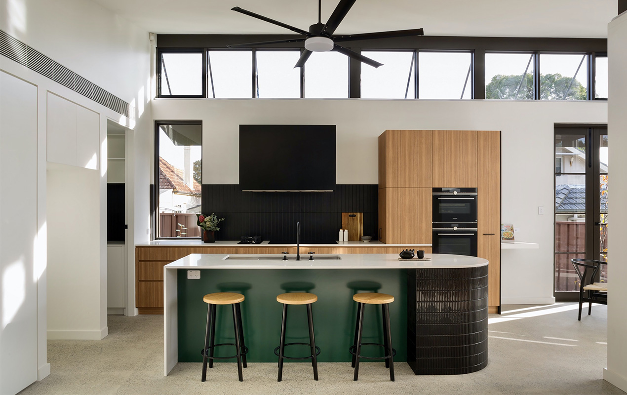Wooden cabinets with white countertops and black & green interior by DeCasa Collections