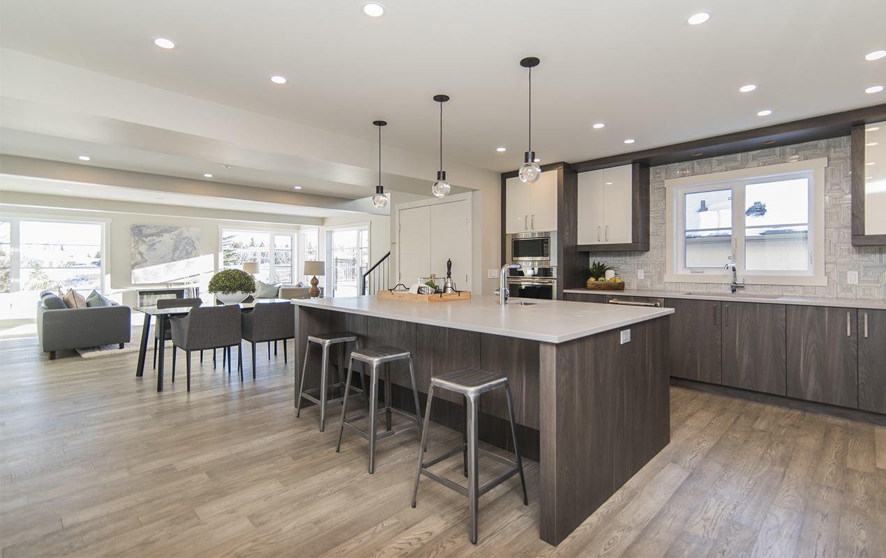 Living room and kitchen island with table by DeCasa Collections