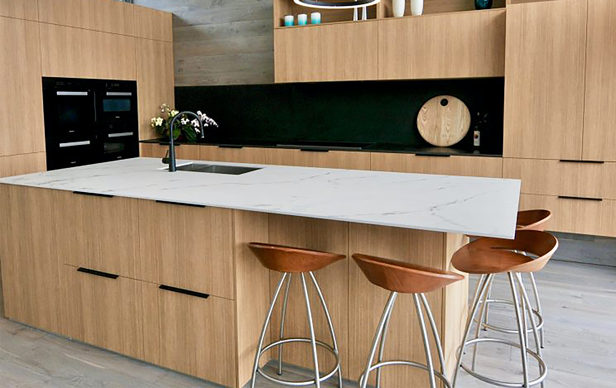 Wood interior with white countertops by DeCasa Collections