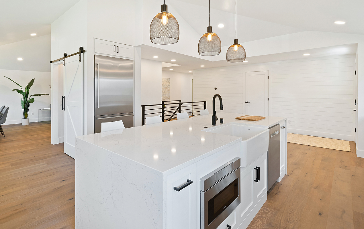 Kitchen island with black hardware by DeCasa Collections