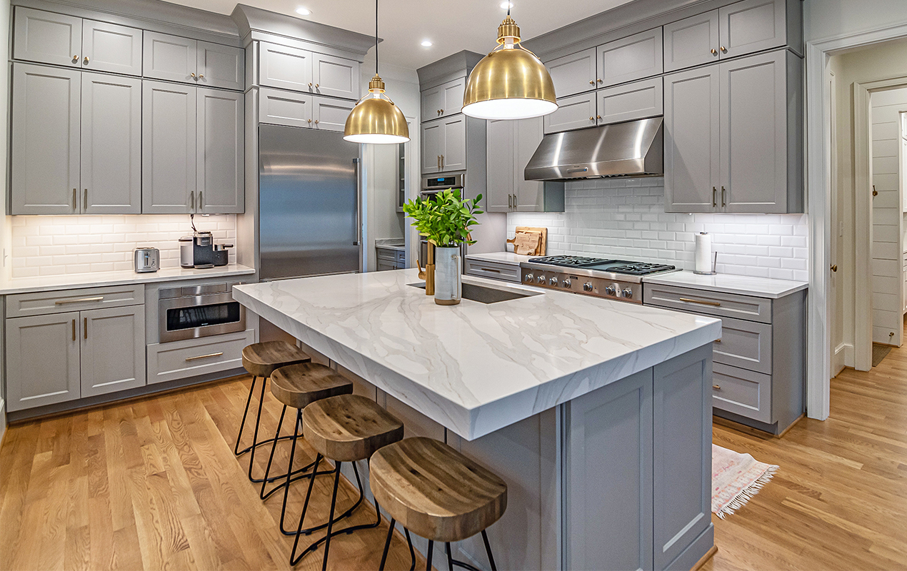 Gray kitchen design with small stools by DeCasa Collections