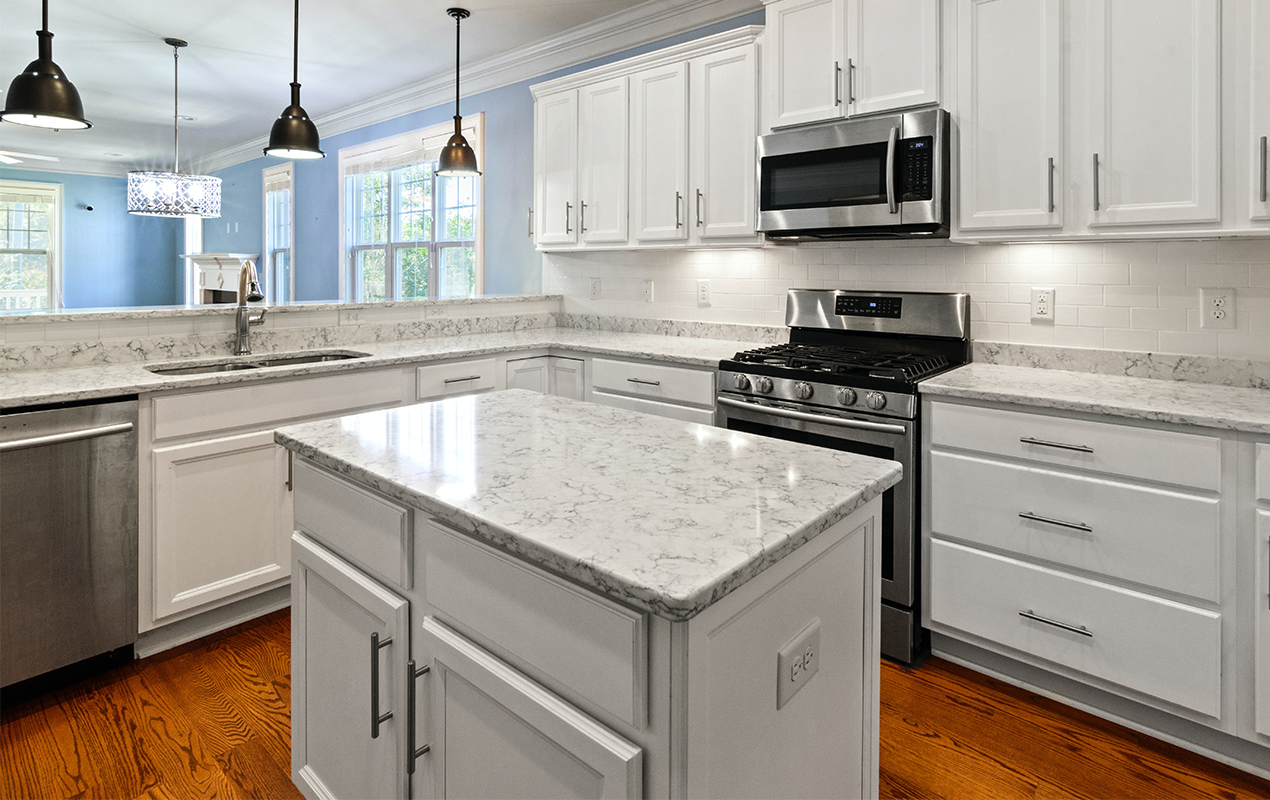 Small kitchen island with twin cabinets by DeCasa Collections