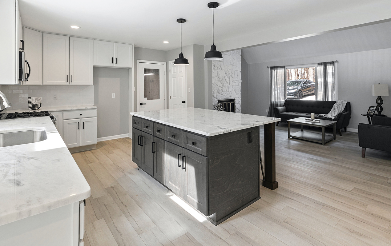 Gray kitchen design with wood cabinets by DeCasa Collections