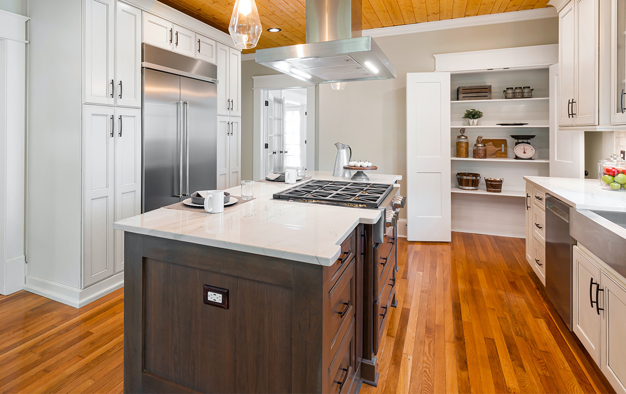 Black and white kitchen island with stove and extraction fan by DeCasa Collections