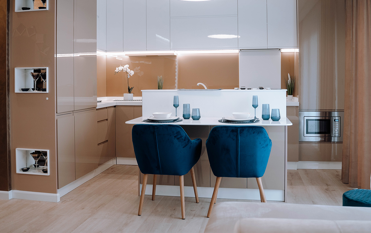 Divided kitchen island with blue seating by DeCasa Collections