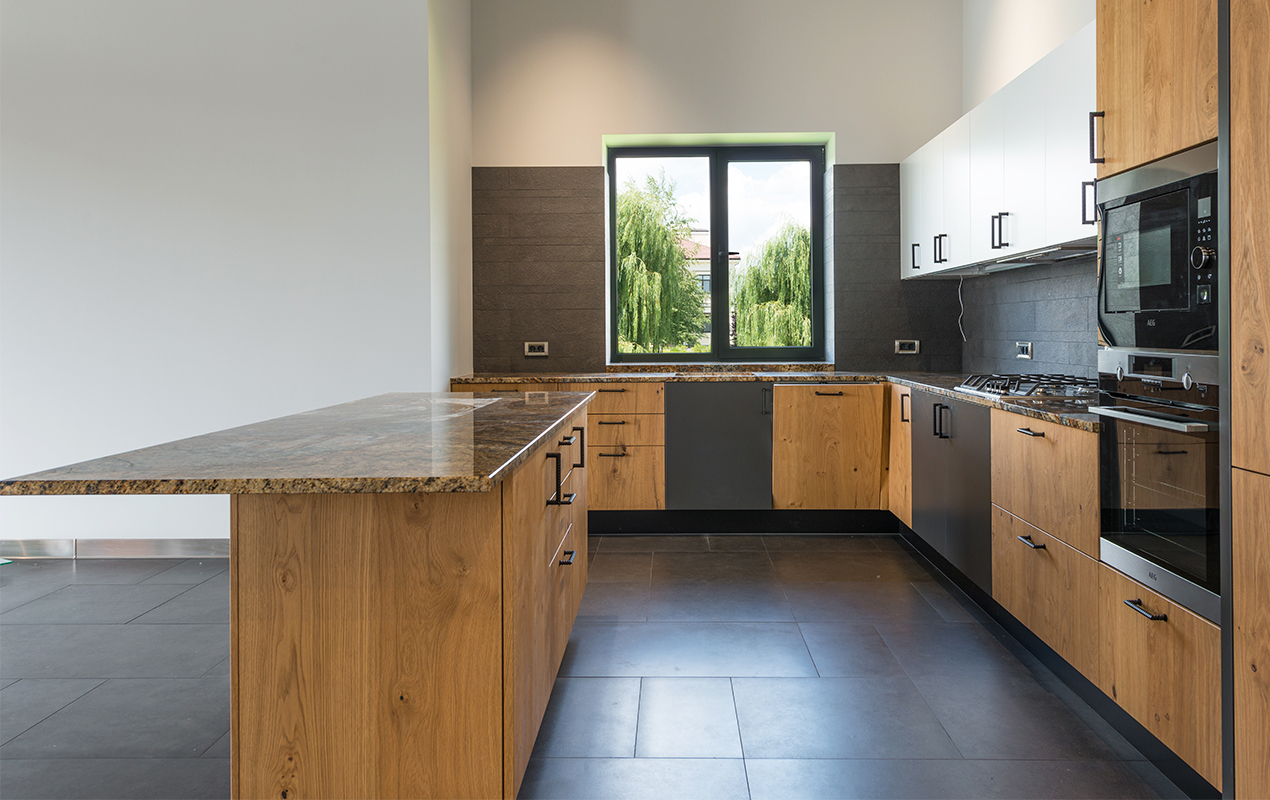 Wood kitchen design with tiled flooring by DeCasa Collections