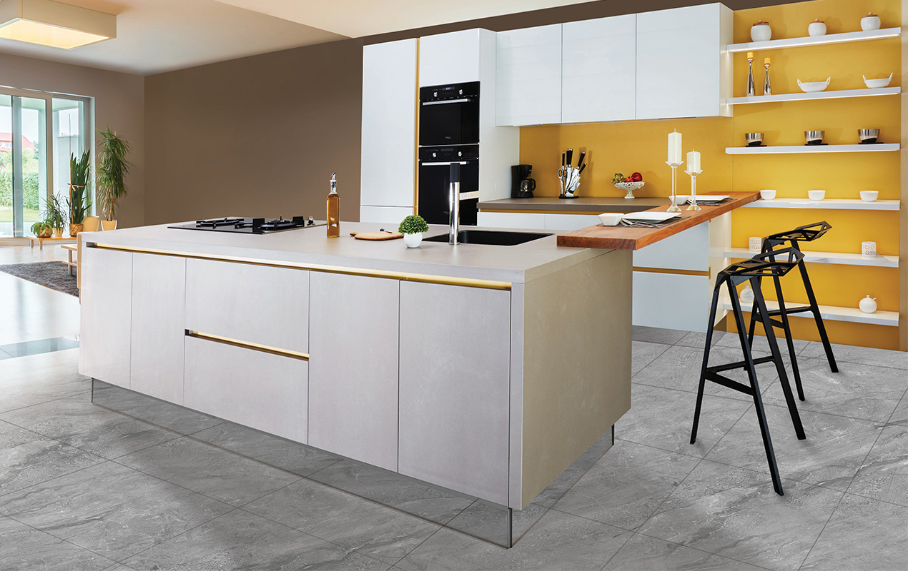 White and yellow kitchen interior design with an island by DeCasa Collections