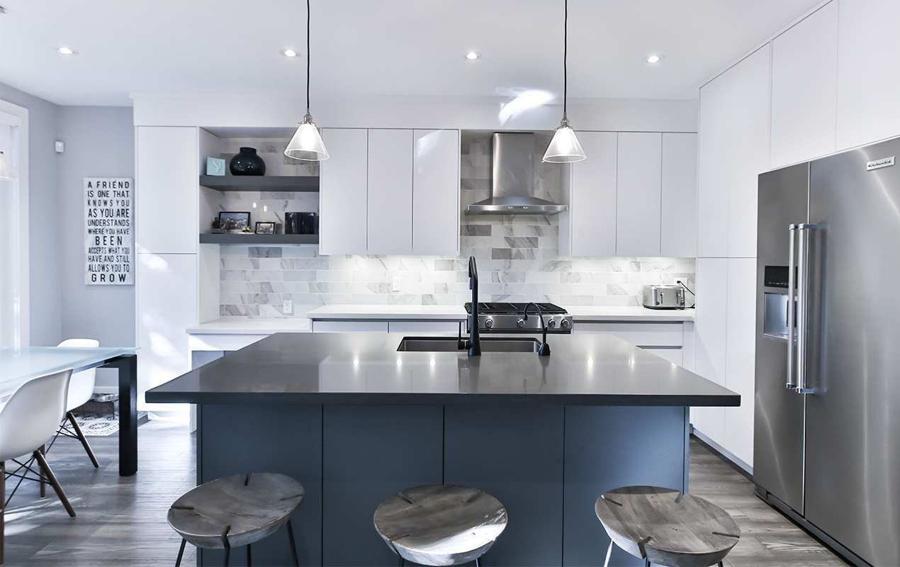White kitchen with gray and blue accents by DeCasa Collections