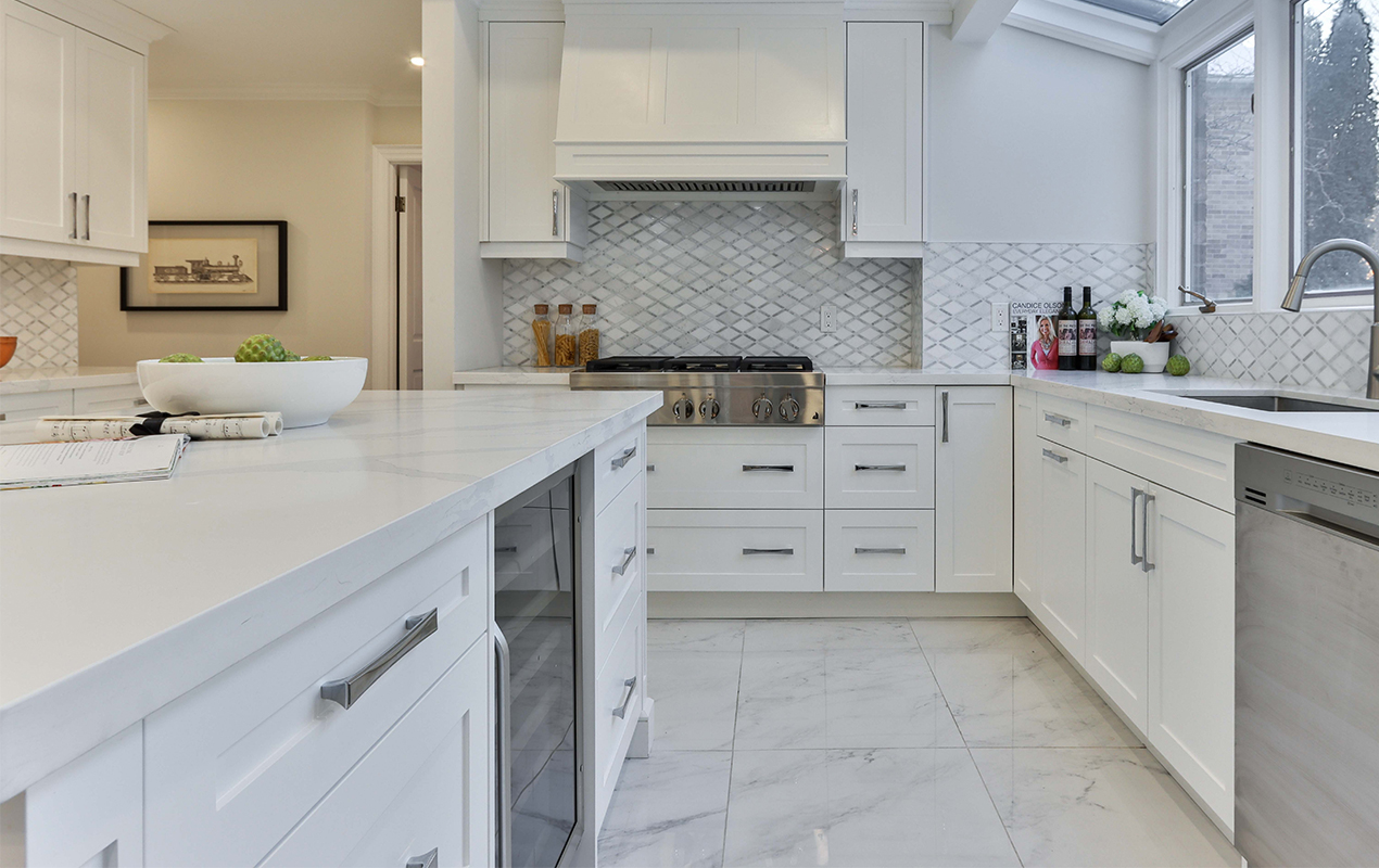 Kitchen interior with integrated fridge by DeCasa Collections