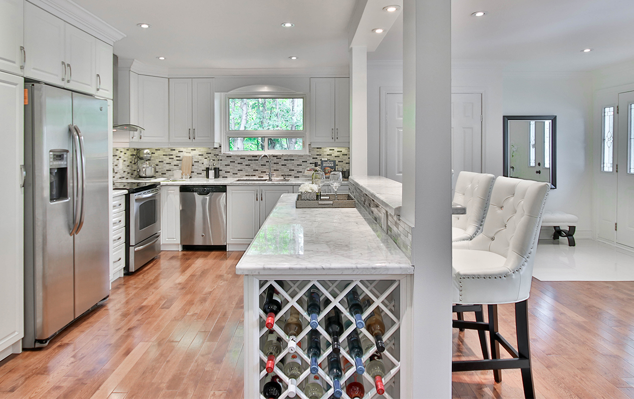 Tiered kitchen island design by DeCasa Collections