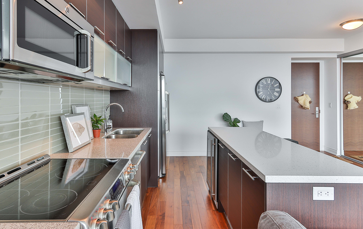 Black and white kitchen with storage by DeCasa Collections