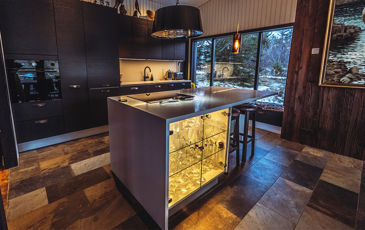 Kitchen island with glass cupboard and induction stove by DeCasa Collections