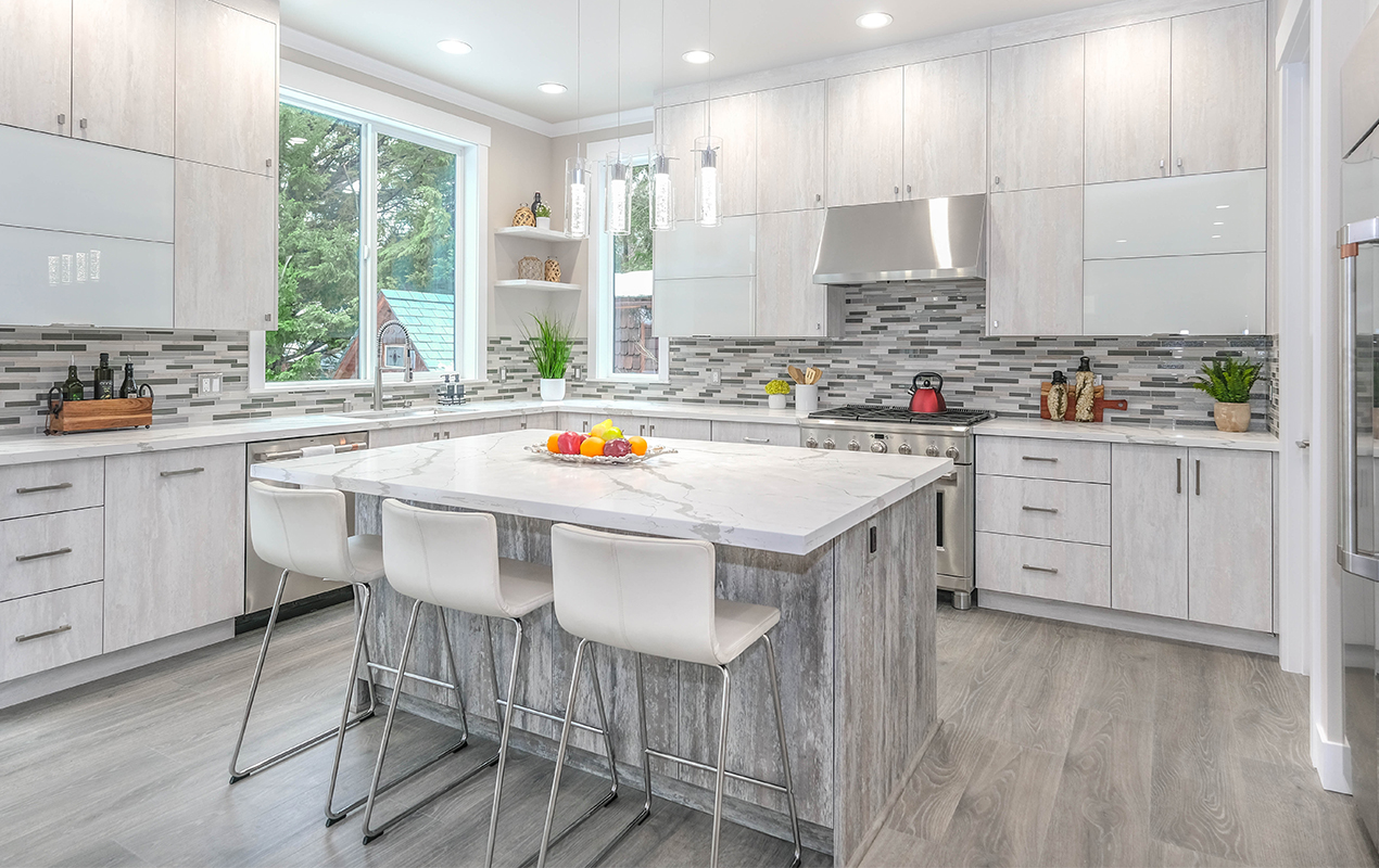 White kitchen with gray accents and white seating by DeCasa Collections