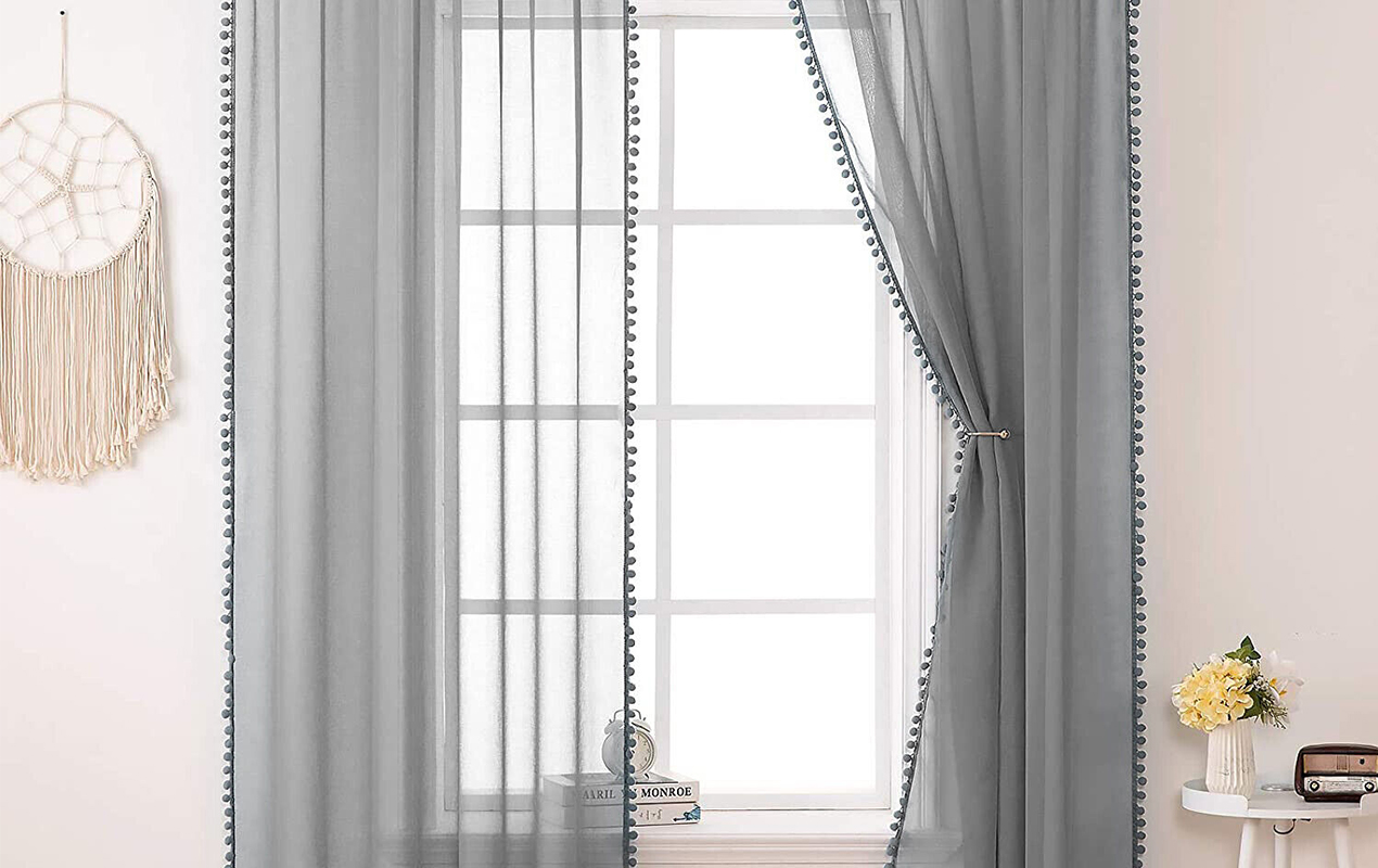 Living room interior with pom pom curtains