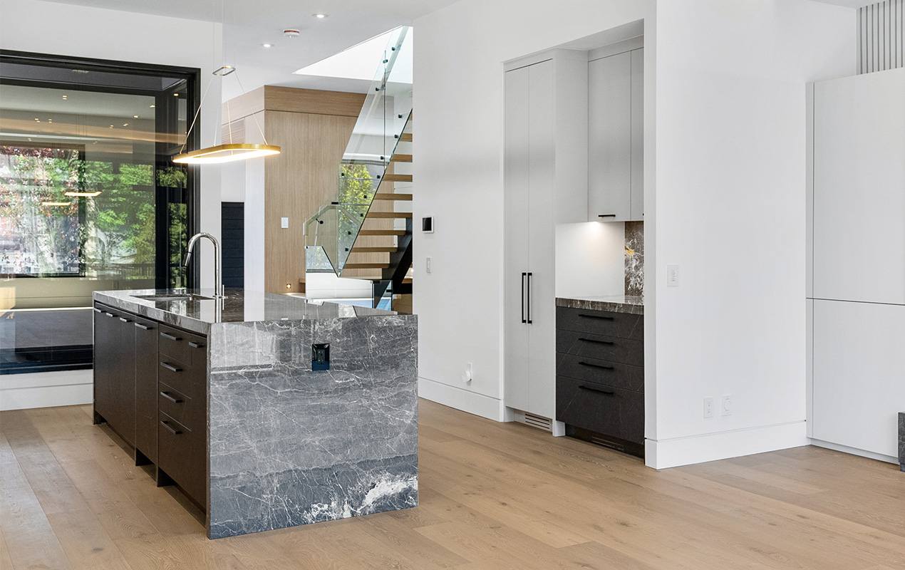 Dark gray marble kitchen island by DeCasa Collections