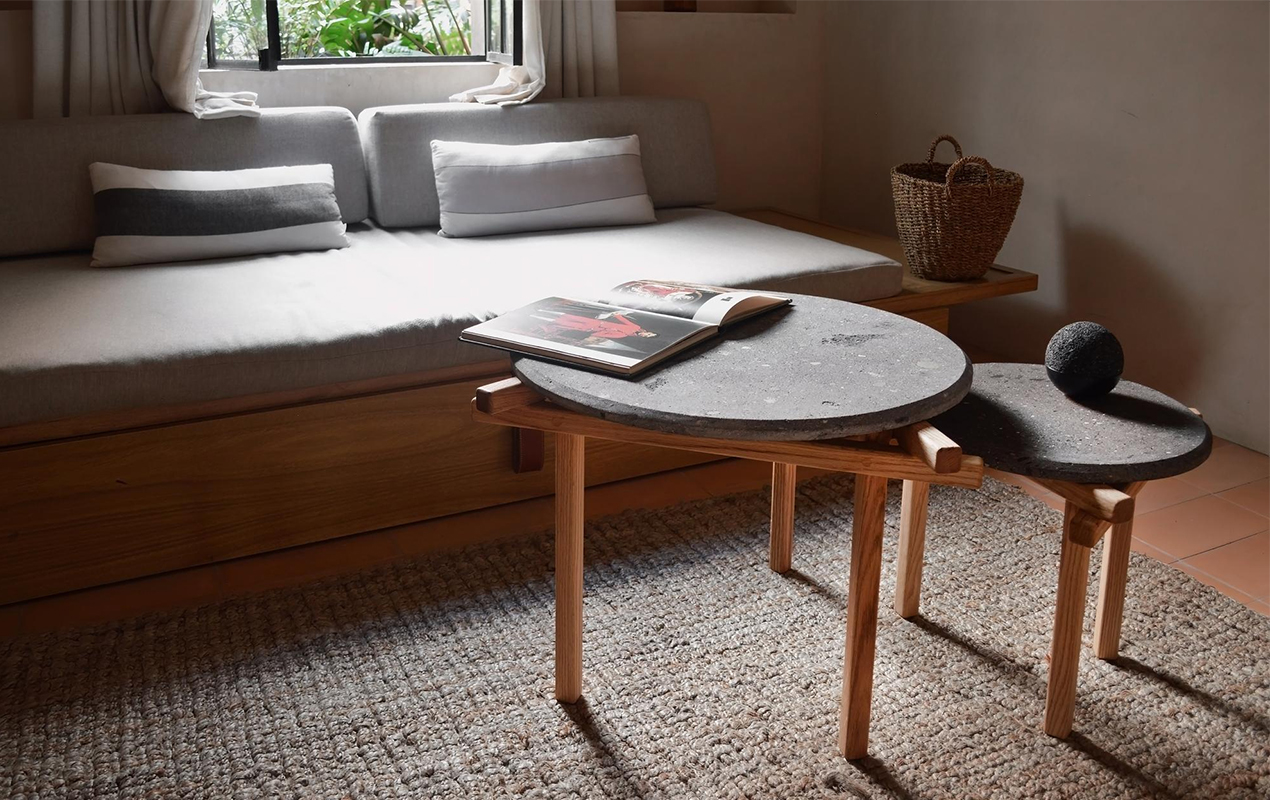 Living room with couch and wood and marble tables