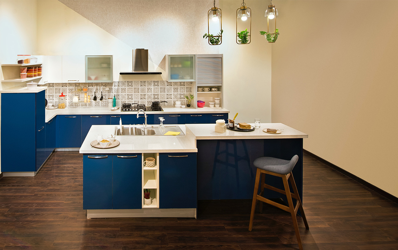 Blue l shape kicten island with white countertop by DeCasa Collections