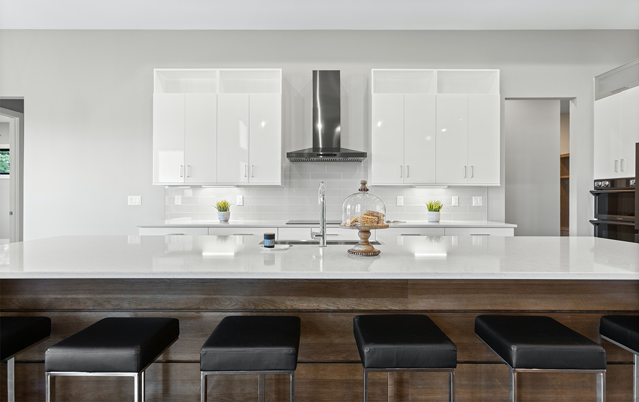 Wood kitchen island with white countertop by DeCasa Collections