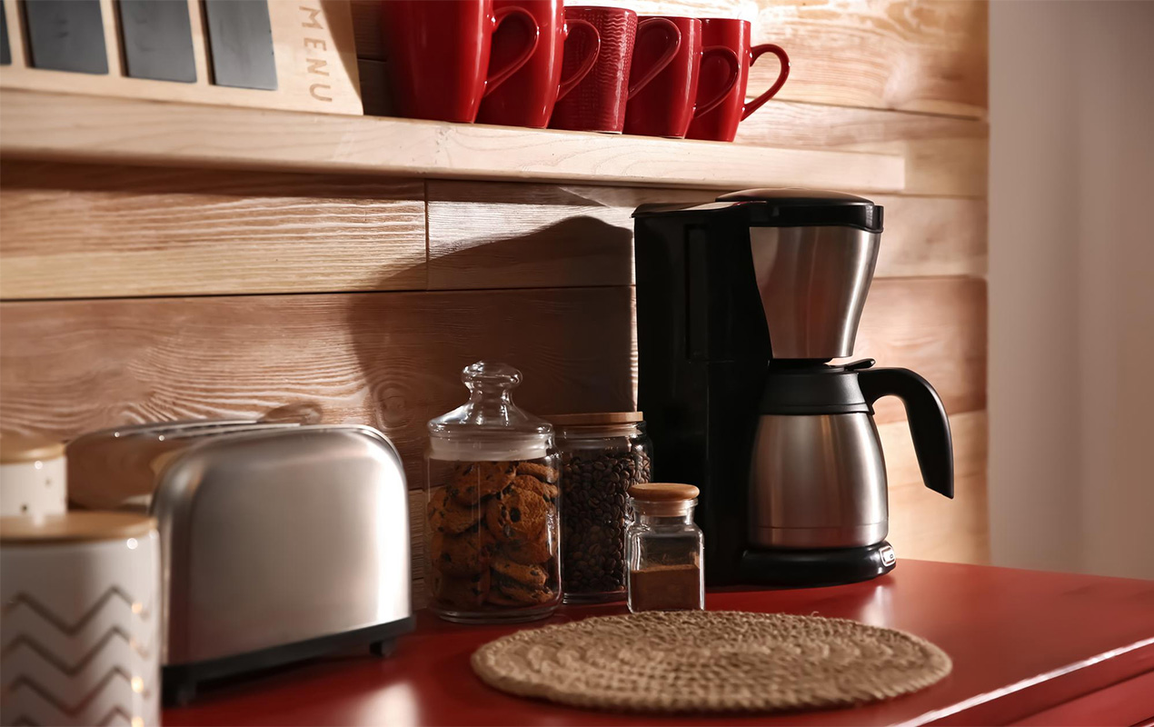 Coffee station with red mugs and countertop