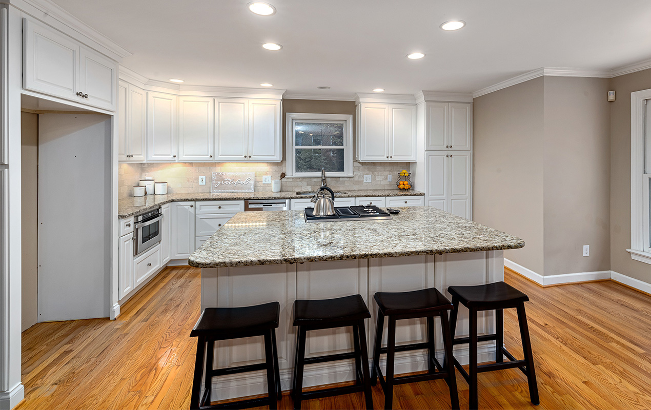 Kitchen design with wood floor by DeCasa Collections